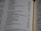 A close-up of an open book page featuring a list of names and numbers, possibly indicating a genealogical or historical record. The text is printed in a clear font, and the page is slightly curved, suggesting a book with several pages.