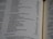 A close-up of an open book page featuring a list of names and numbers, possibly indicating a genealogical or historical record. The text is printed in a clear font, and the page is slightly curved, suggesting a book with several pages.