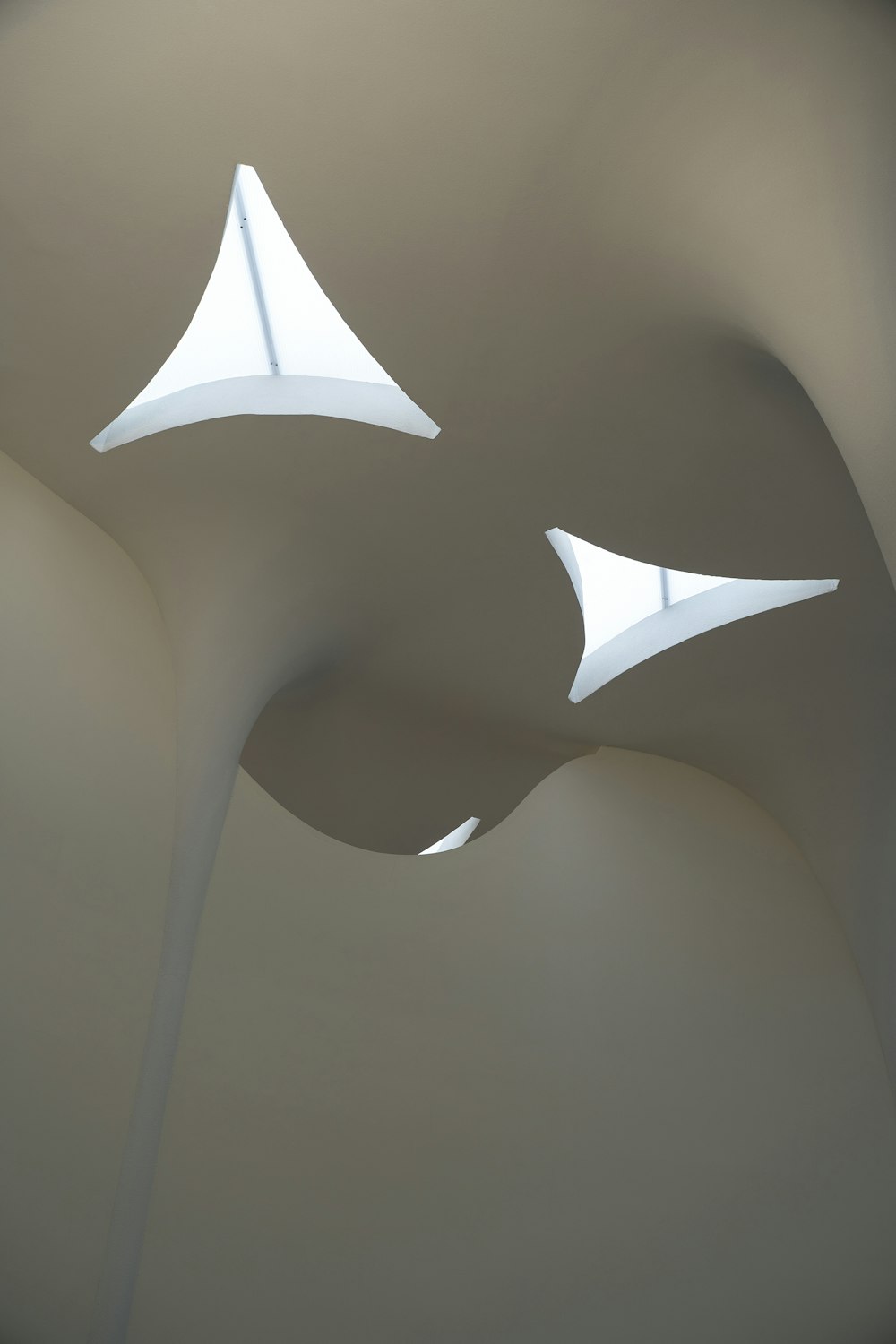 an abstract photo of a curved ceiling