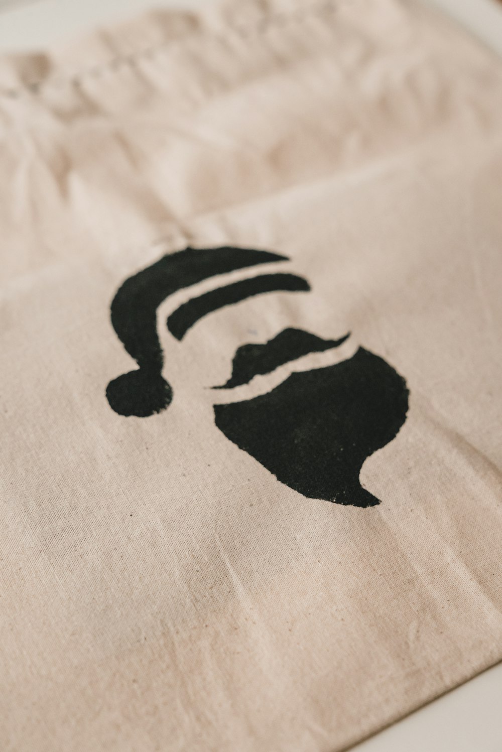 a bag with a picture of a man with a beard