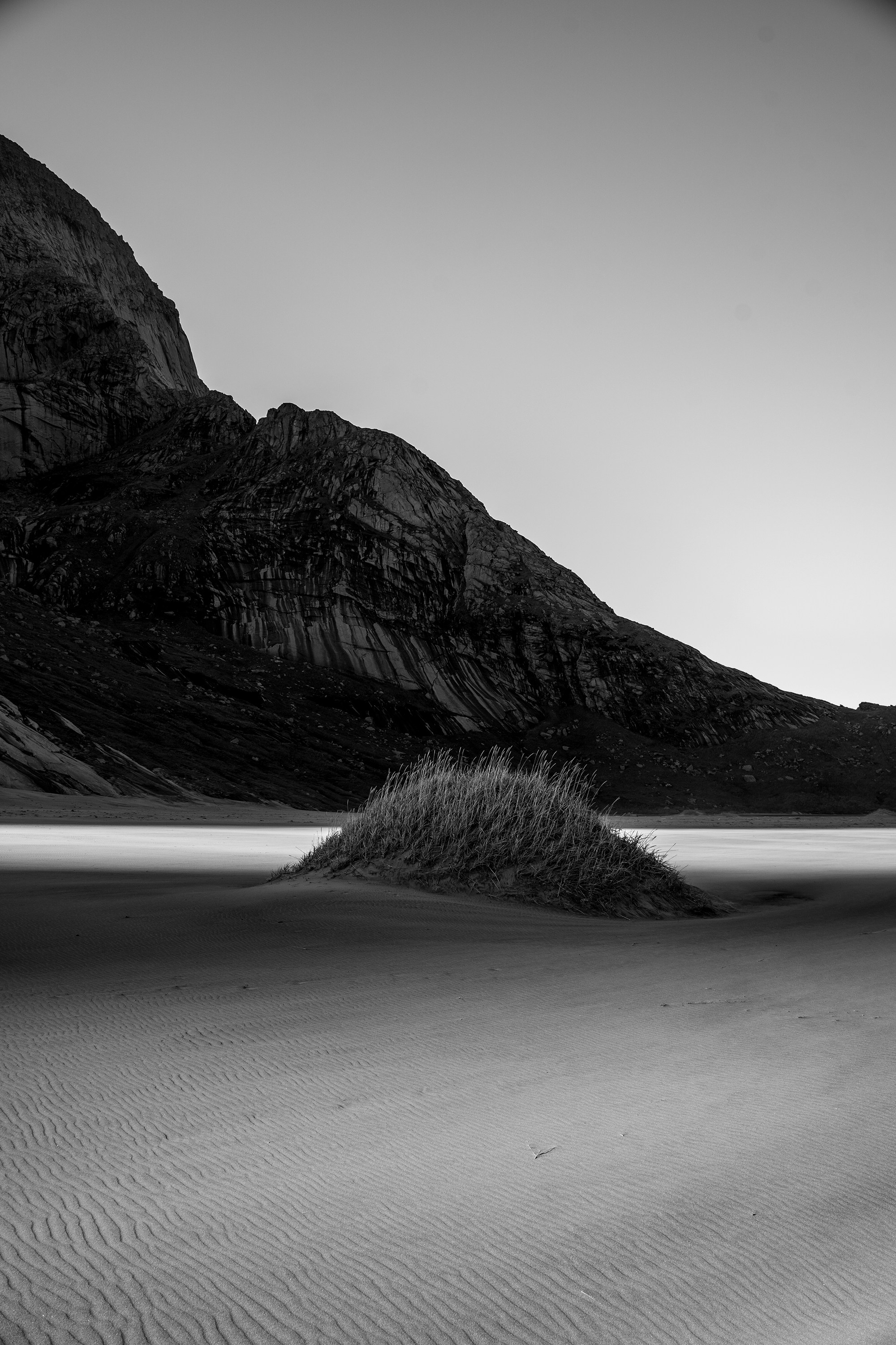 a black and white photo of a mountain range