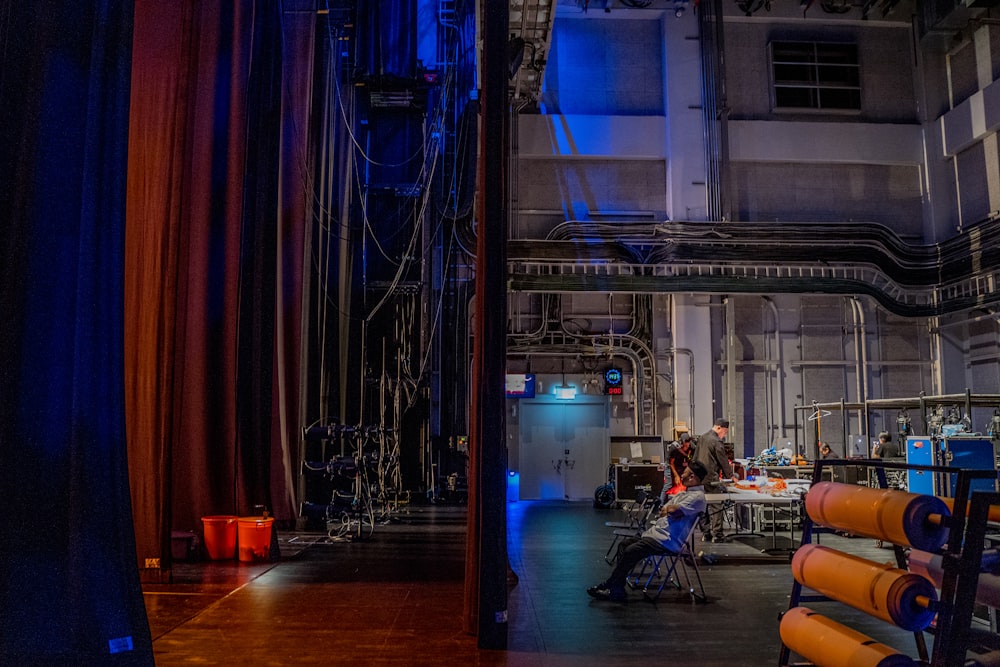 a room filled with lots of equipment and a blue curtain