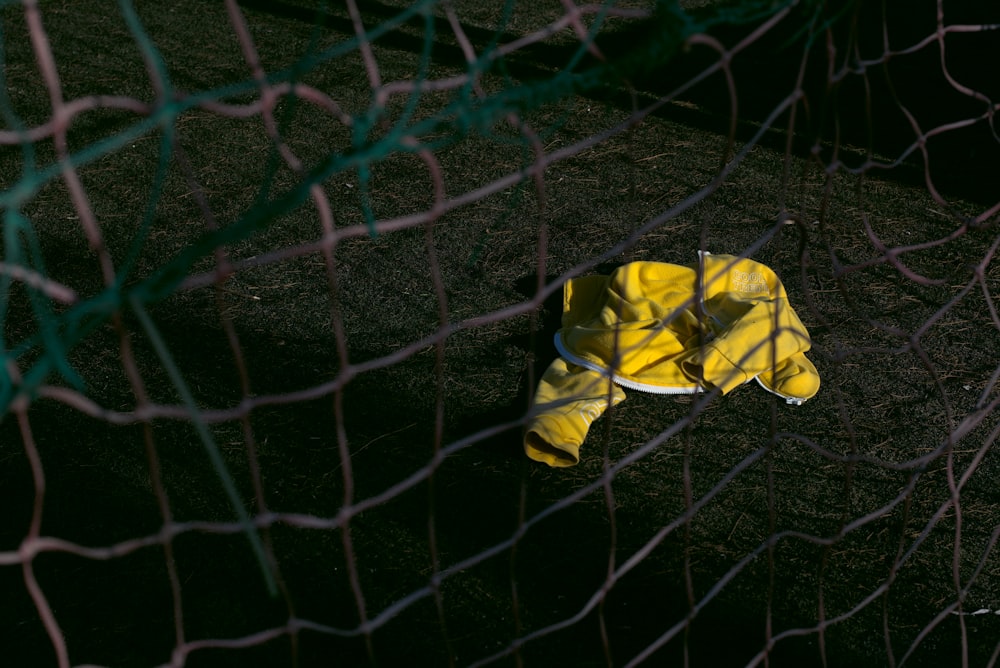 a yellow and white object sitting in the middle of a field
