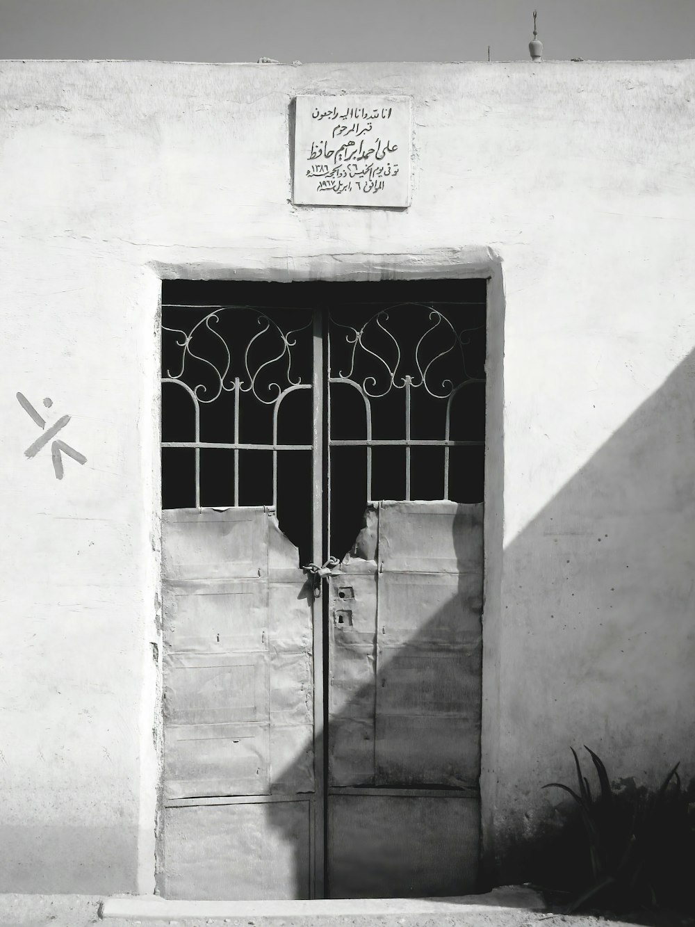 a black and white photo of a door