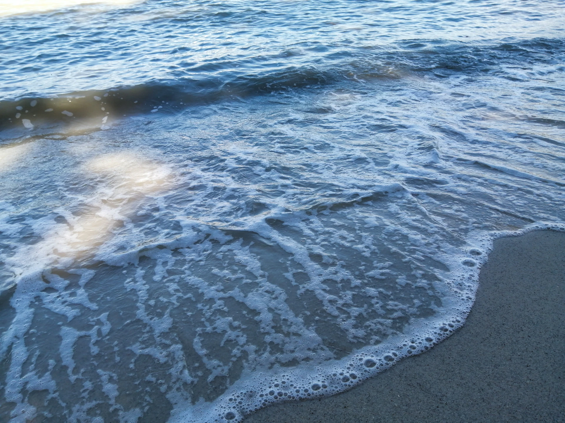woman wearing yellow long-sleeved dress under white clouds and blue sky during daytime