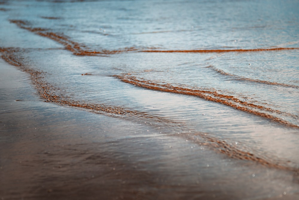 a beach with waves coming in to shore