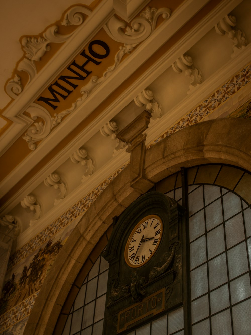 a clock mounted to the side of a building