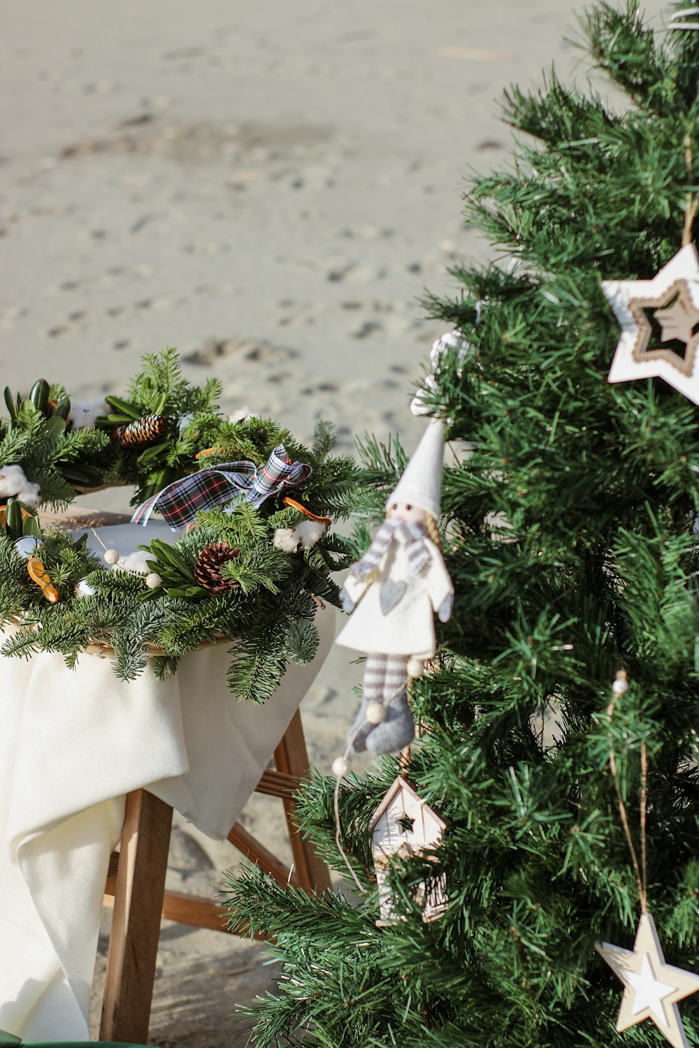 a christmas tree with a wreath on top of it