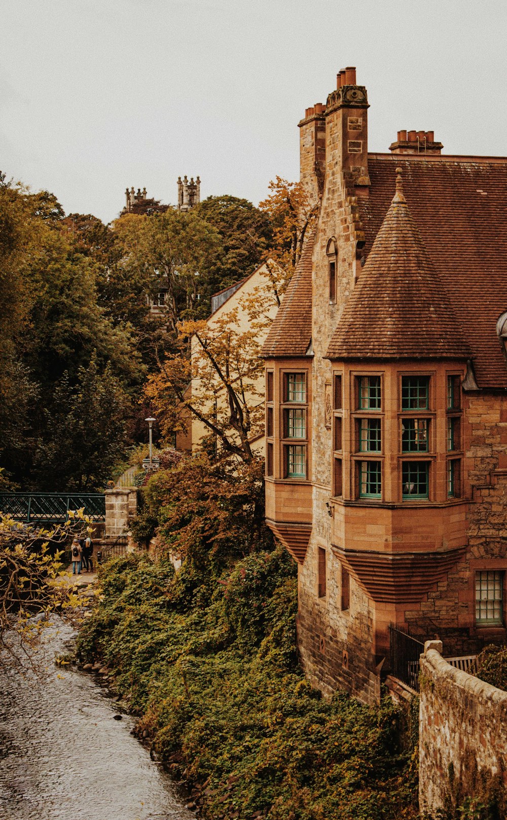 an old building with a river running through it