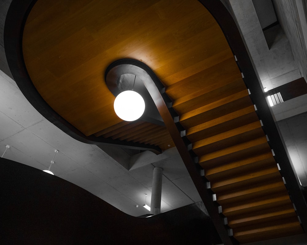 a spiral staircase in a building with a light on