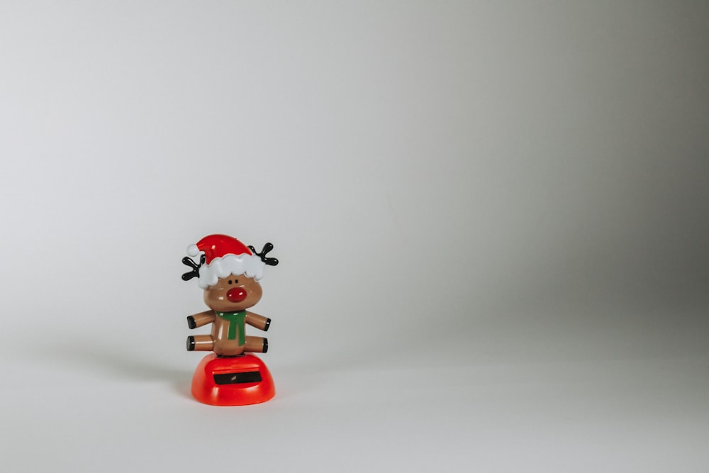 a toy with a santa hat on top of it