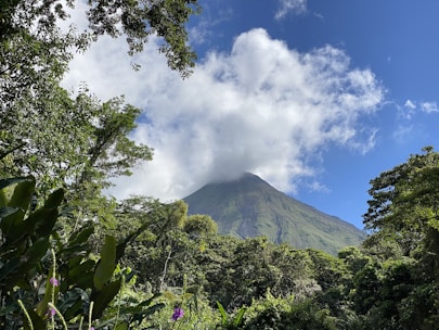 a view of a mountain with a cloud in the sky