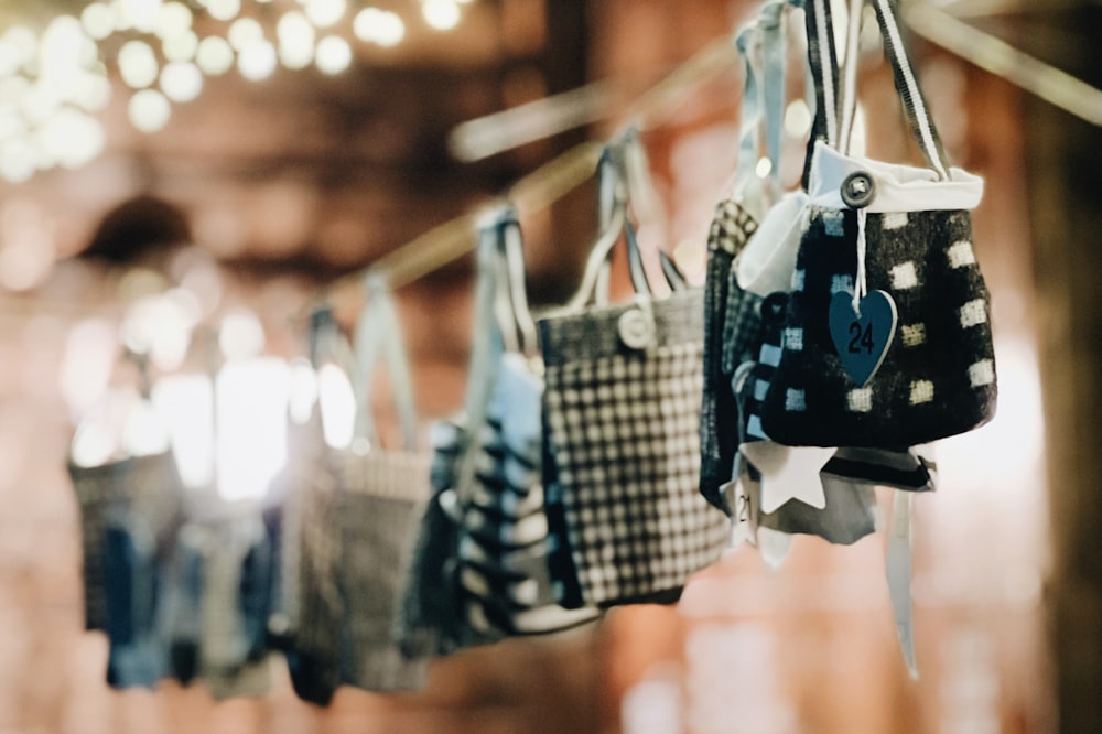 a row of handbags hanging from a string