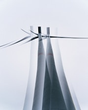 a group of wind turbines with a sky background