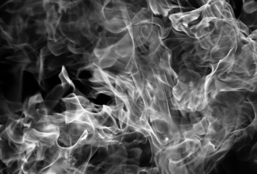 a black and white photo of smoke