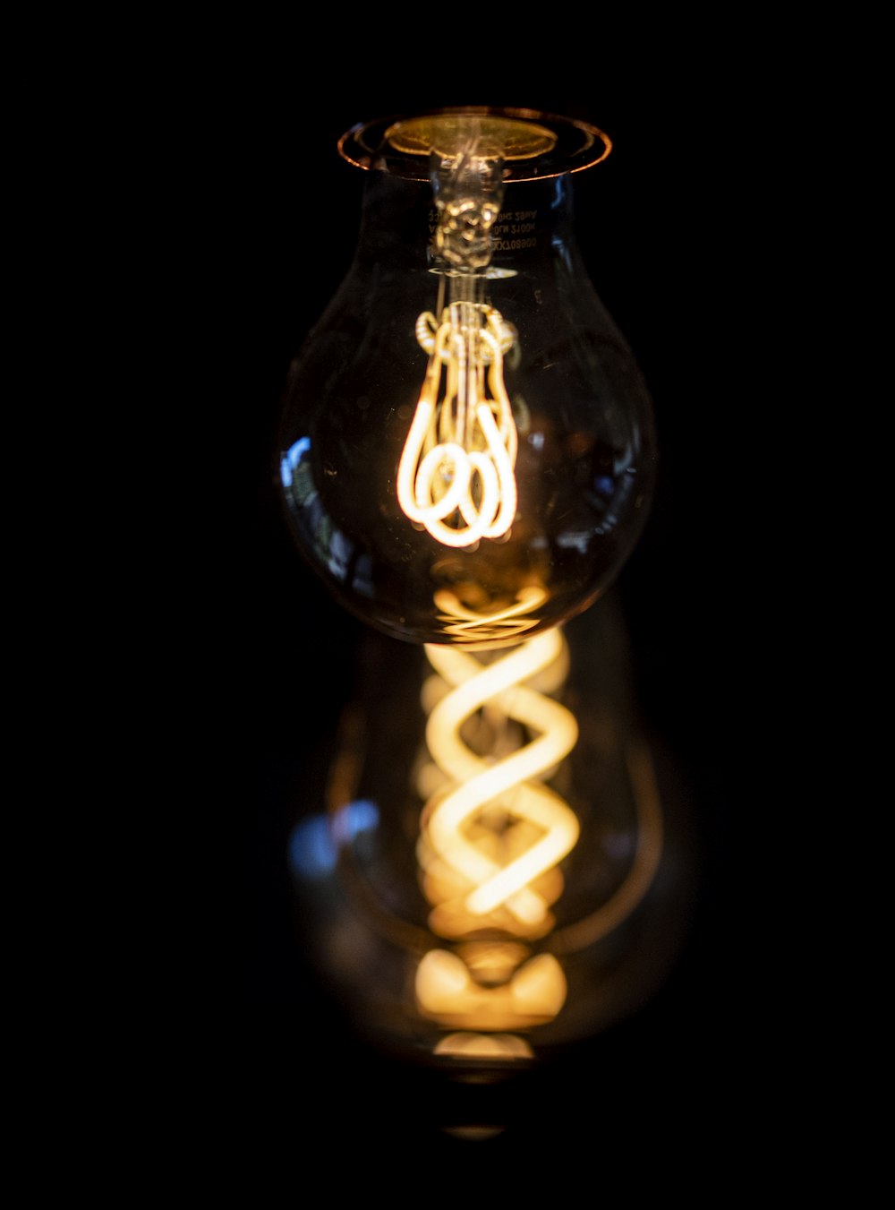 a light bulb is lit up in the dark