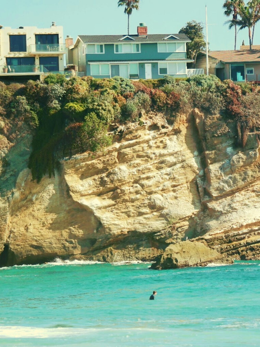 a house on a cliff overlooking the ocean