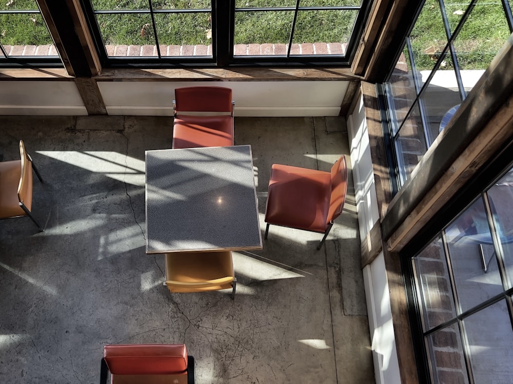 an overhead view of a table and chairs in a room