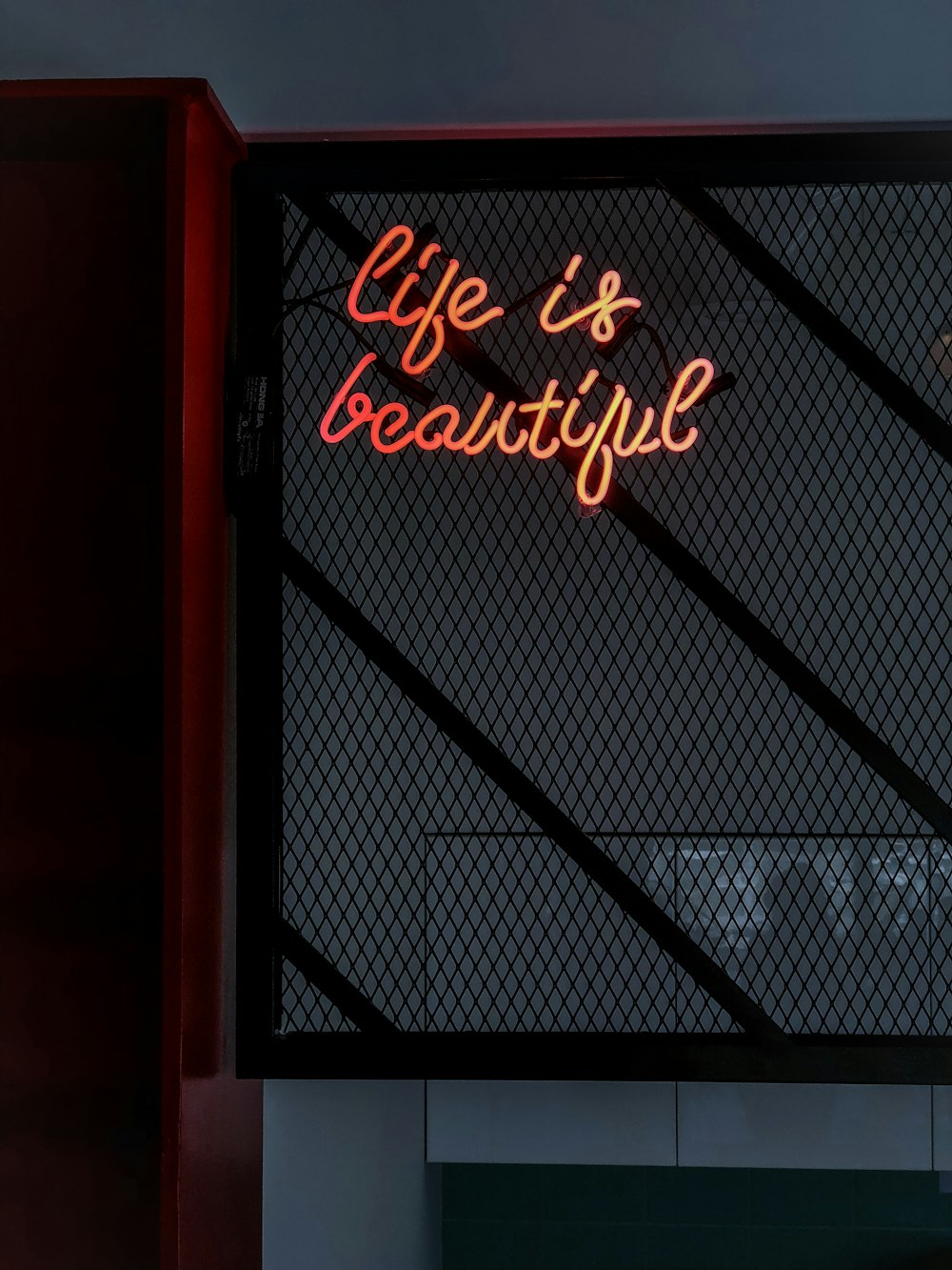 a neon sign that says life is beautiful