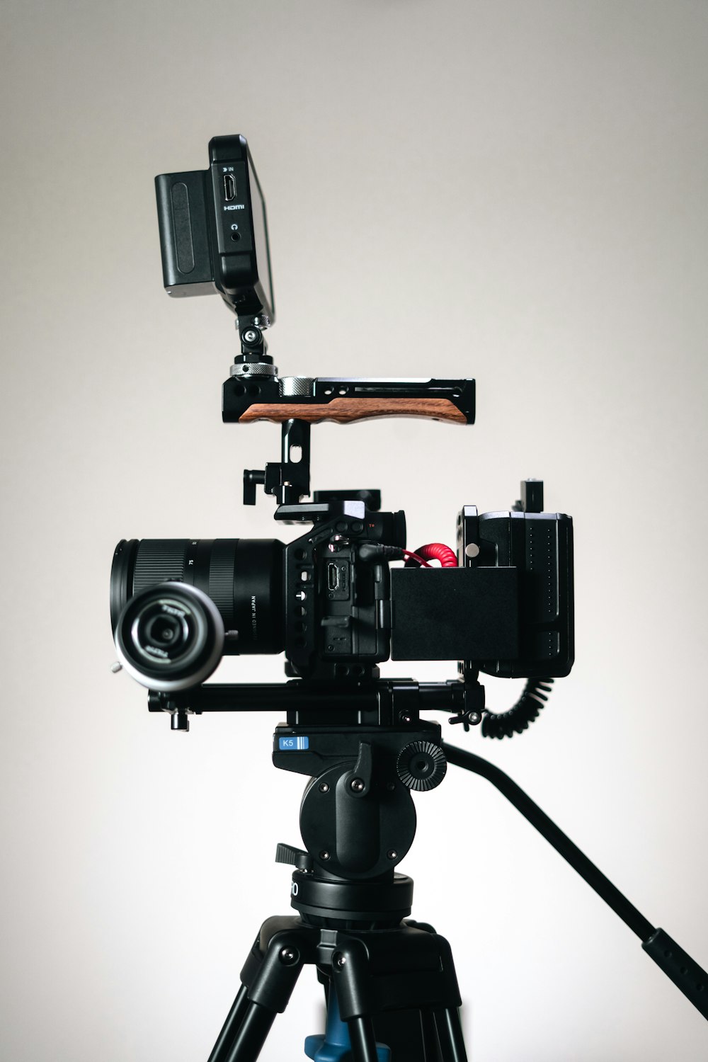 a tripod with a camera attached to it