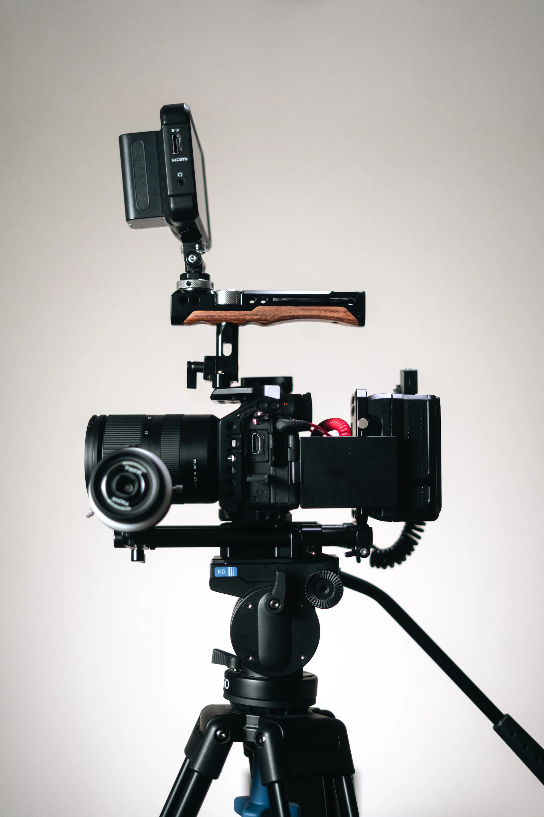 A camera on a tripod set up for an interview