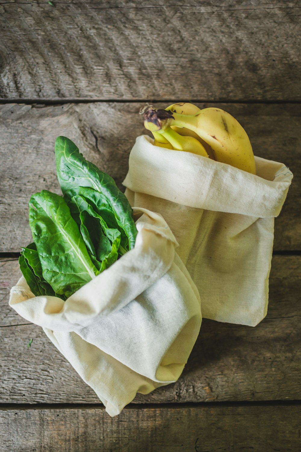 a bunch of green leafy vegetables in a bag