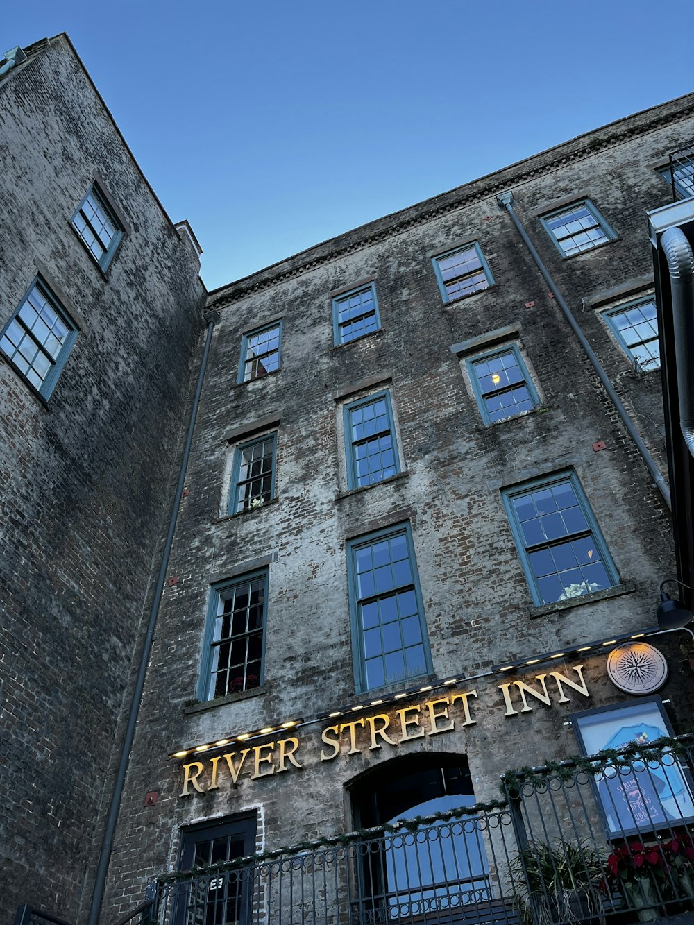 a tall brick building with a sign on the front of it