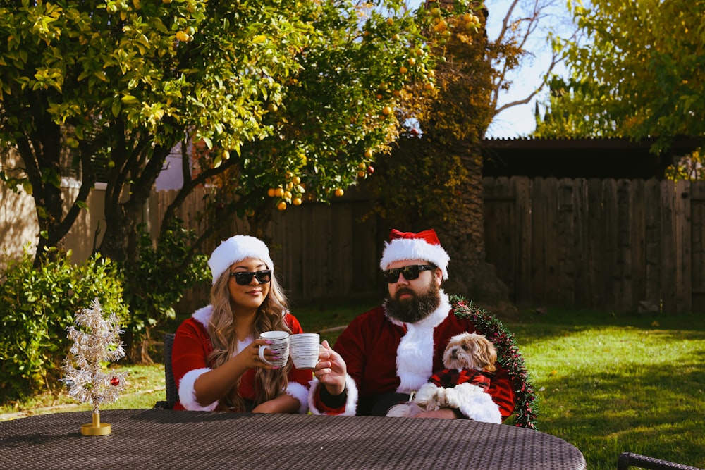 a man and woman dressed up as santa and mrs claus