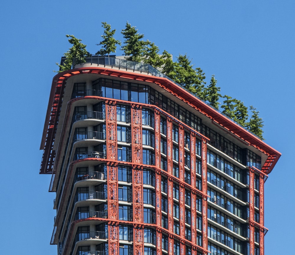 a very tall building with a tree on top of it