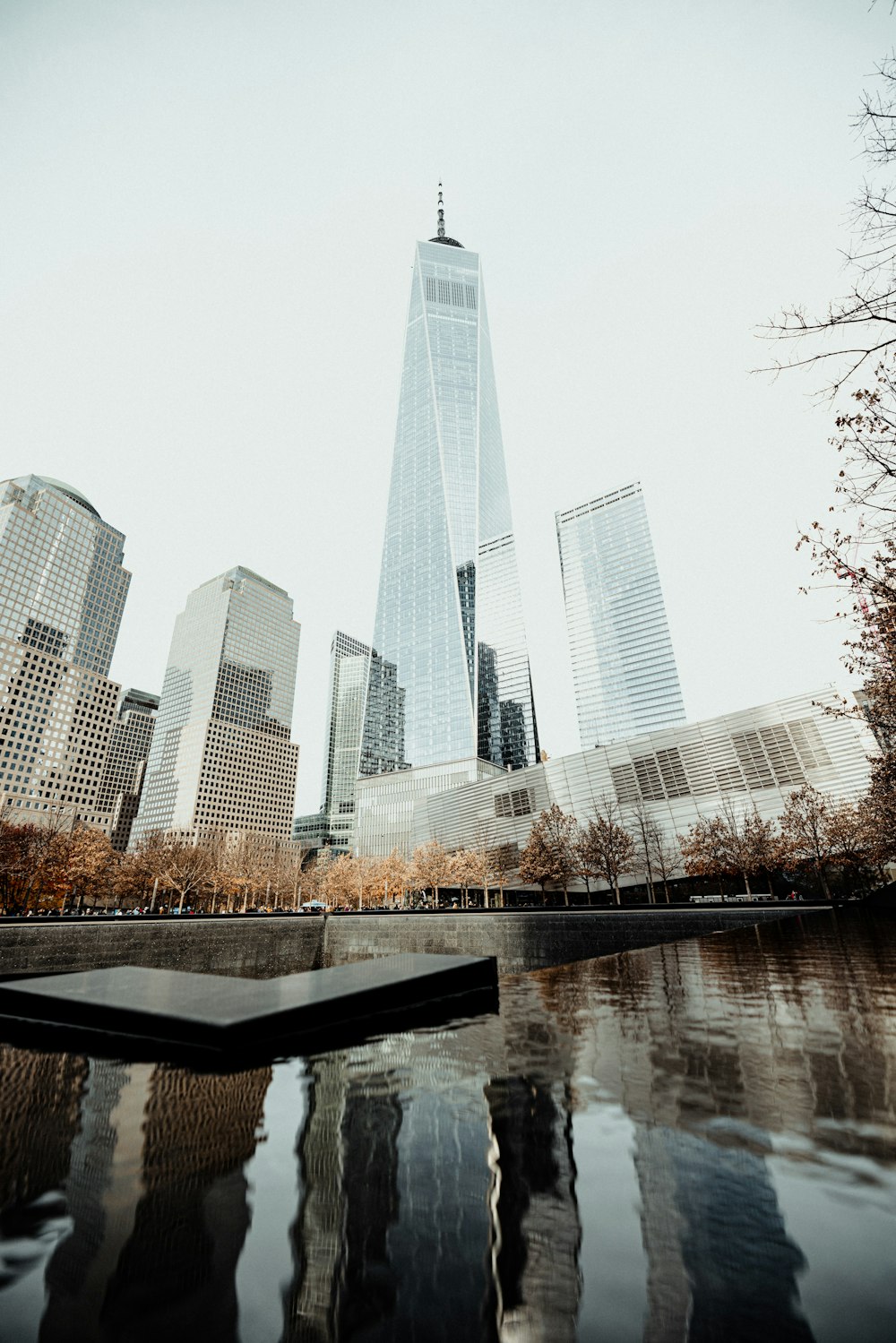 a view of a city with skyscrapers and a body of water