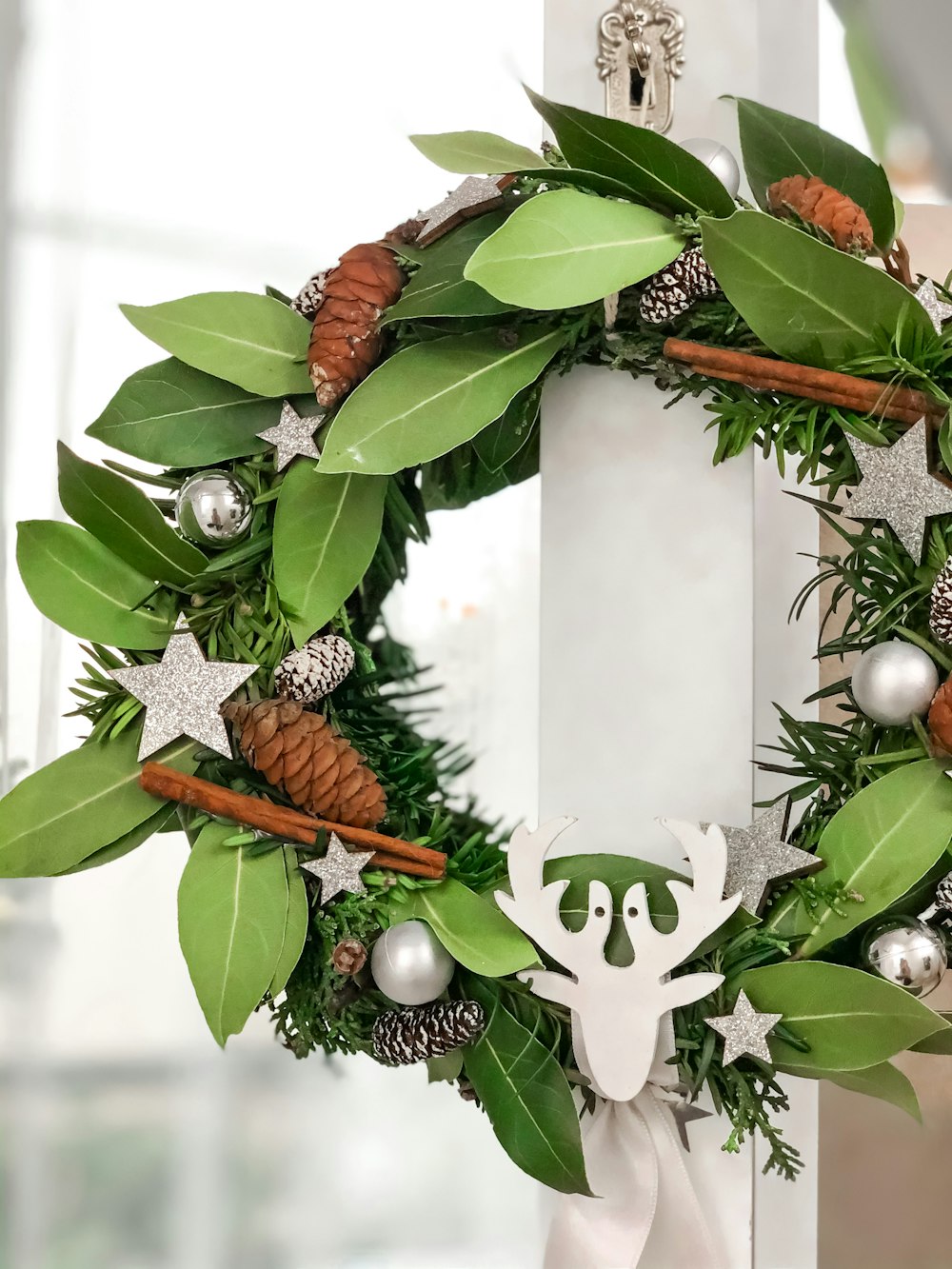 a christmas wreath hanging on a door