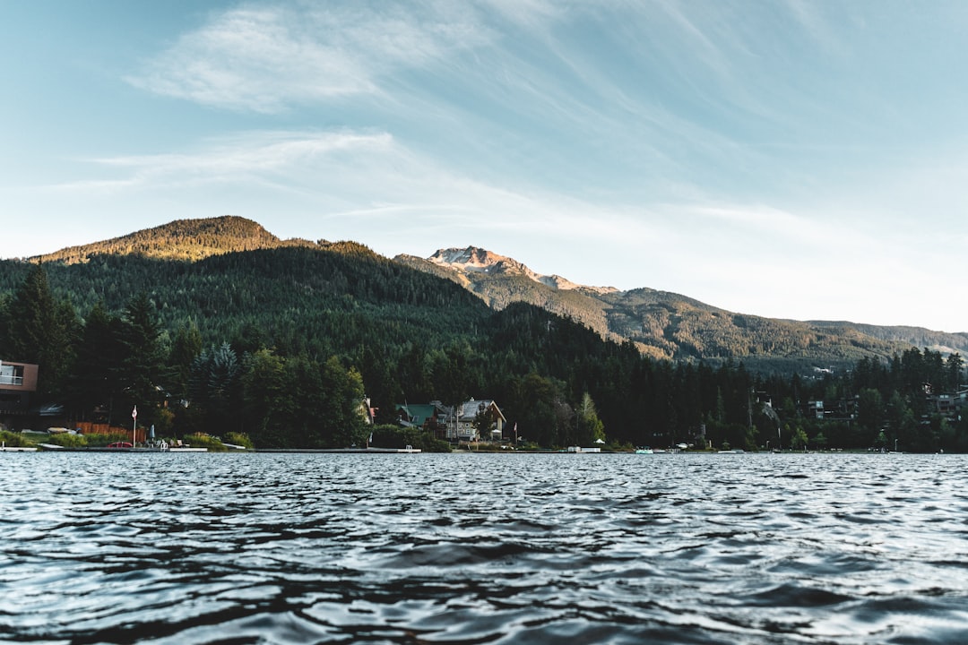 a body of water with a mountain in the background