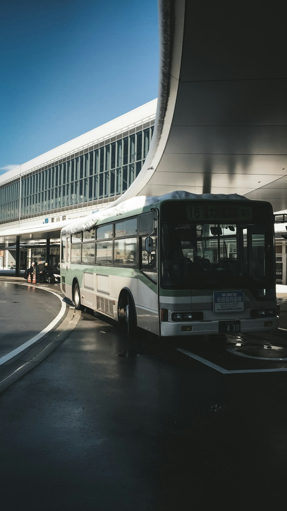 a bus is parked in front of a building