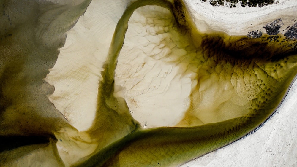 an aerial view of a river in the mountains