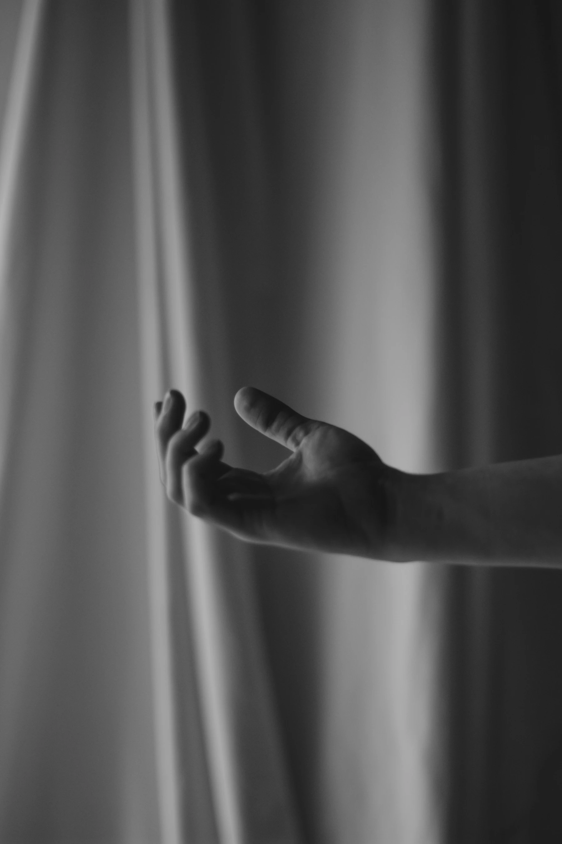 An Open Hand Reaching Into Soft Light