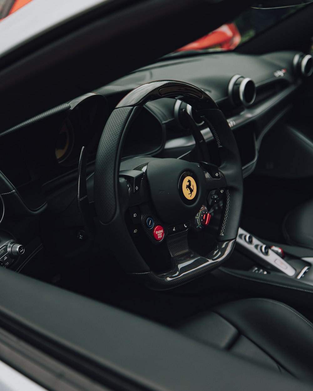 a close up of a steering wheel in a sports car