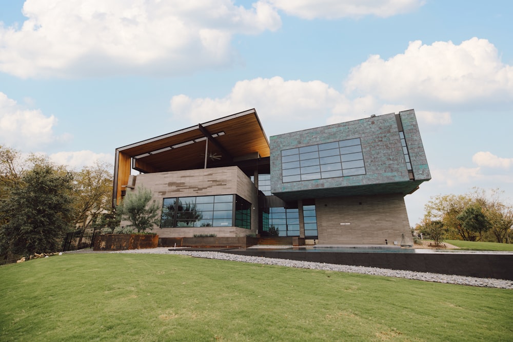 a large building with a large lawn in front of it