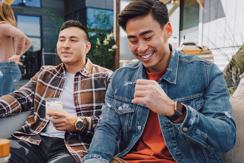 gay couple sitting close together