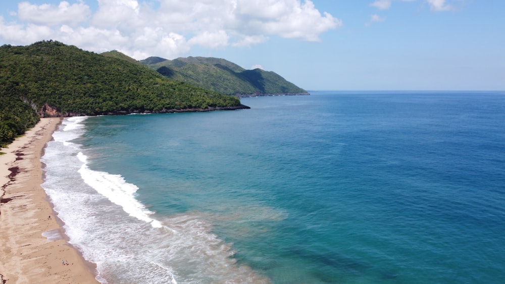 a view of a beach with a mountain in the background