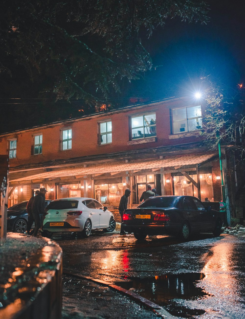 a group of cars parked in front of a building