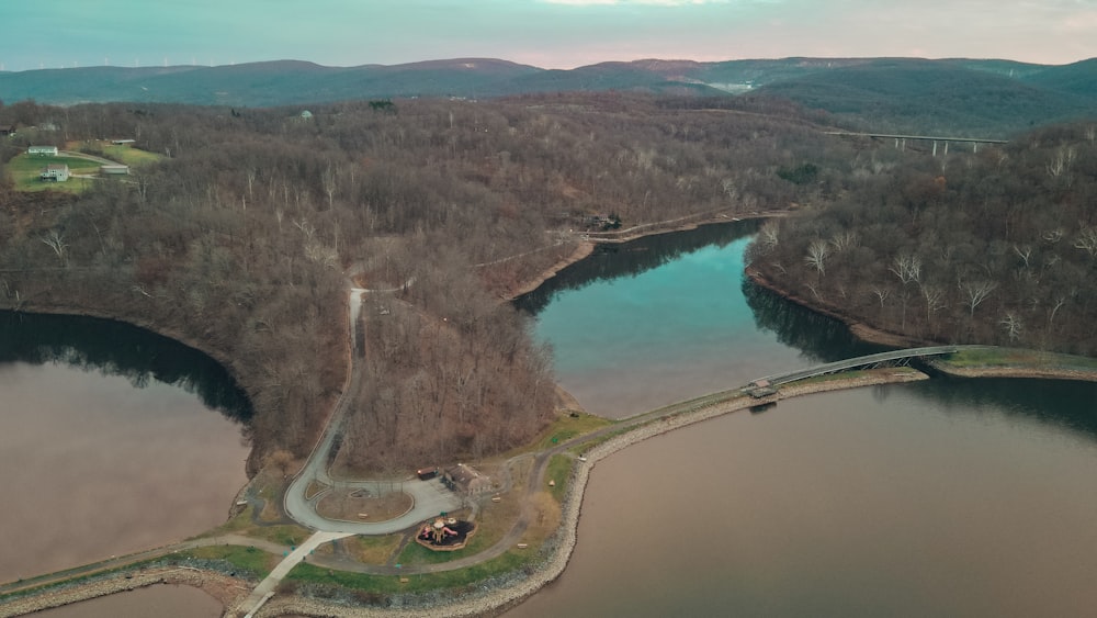 an aerial view of a lake surrounded by trees