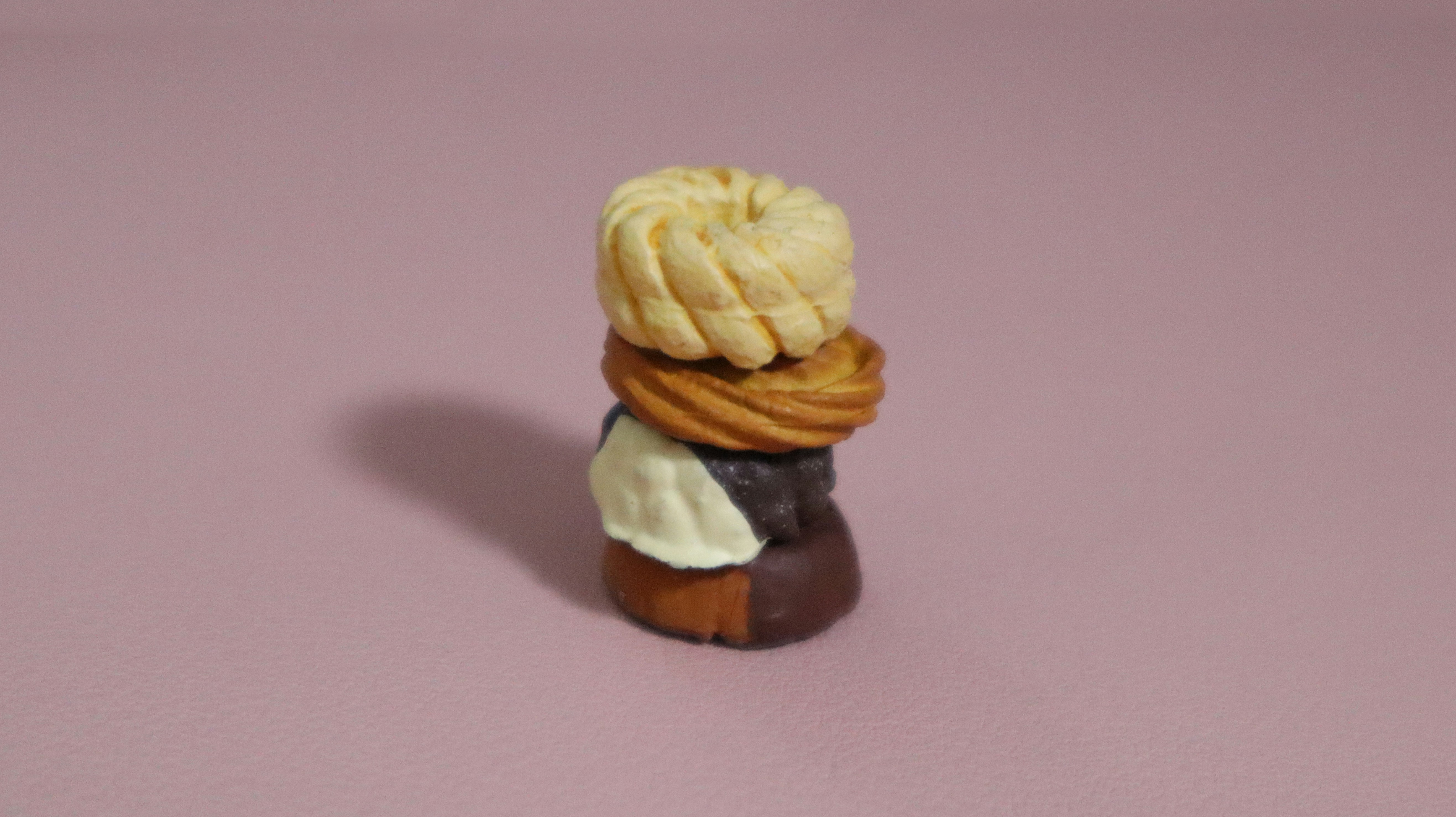 a small figurine of a woman with a braid on her head