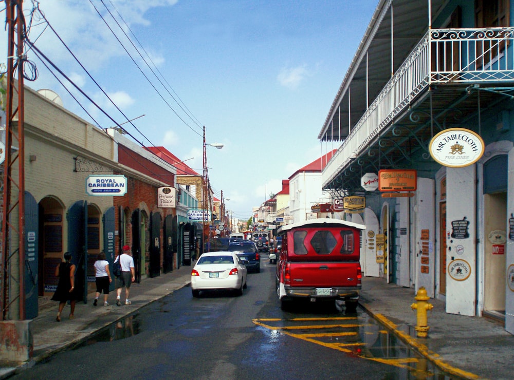 a red van is parked on the side of the road