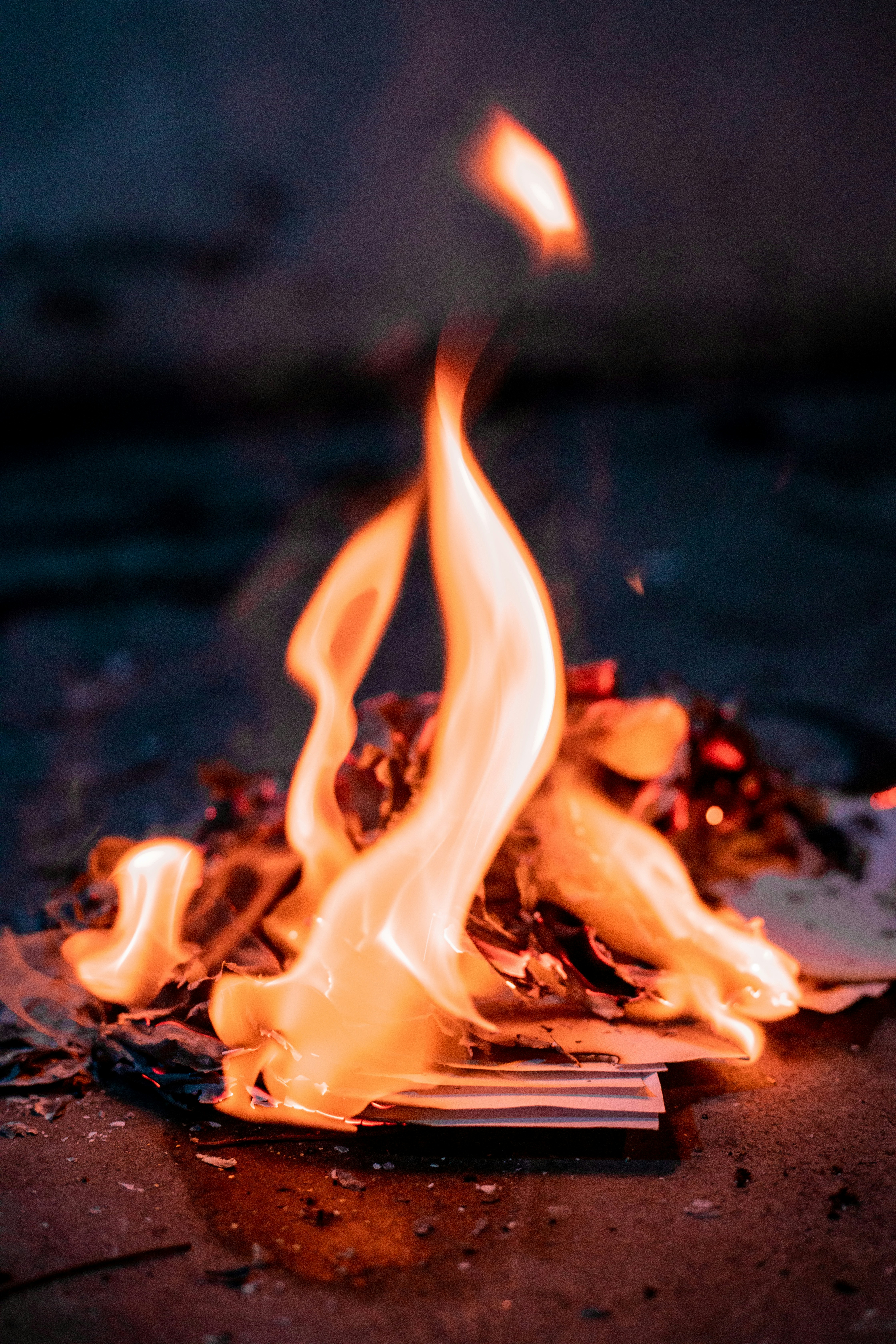 a close up of a burning book on a table