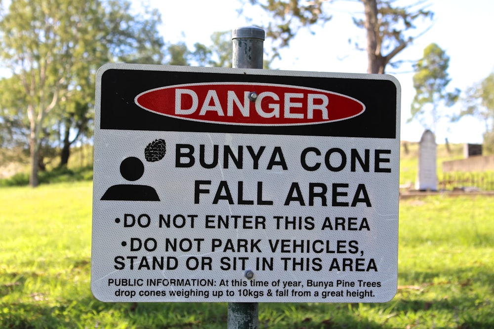 a sign warning of the dangers of bunya cones