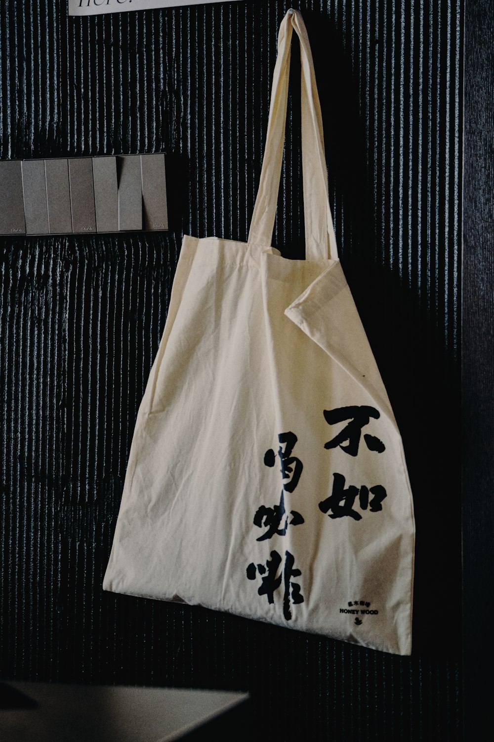 a tote bag hanging on a wall