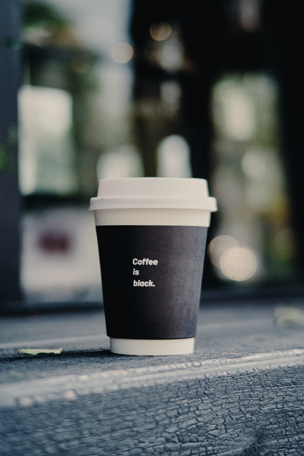 a coffee cup sitting on top of a wooden table