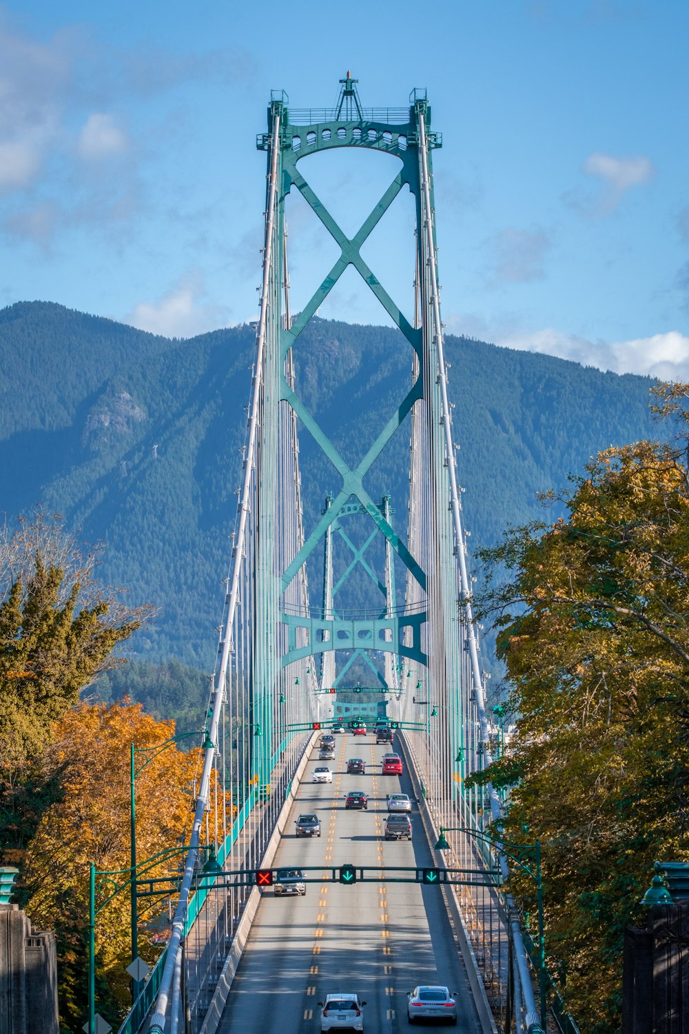 a view of a bridge with cars going over it