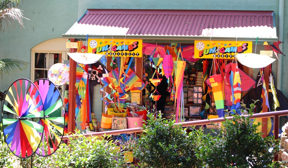 a store front with a bunch of colorful umbrellas