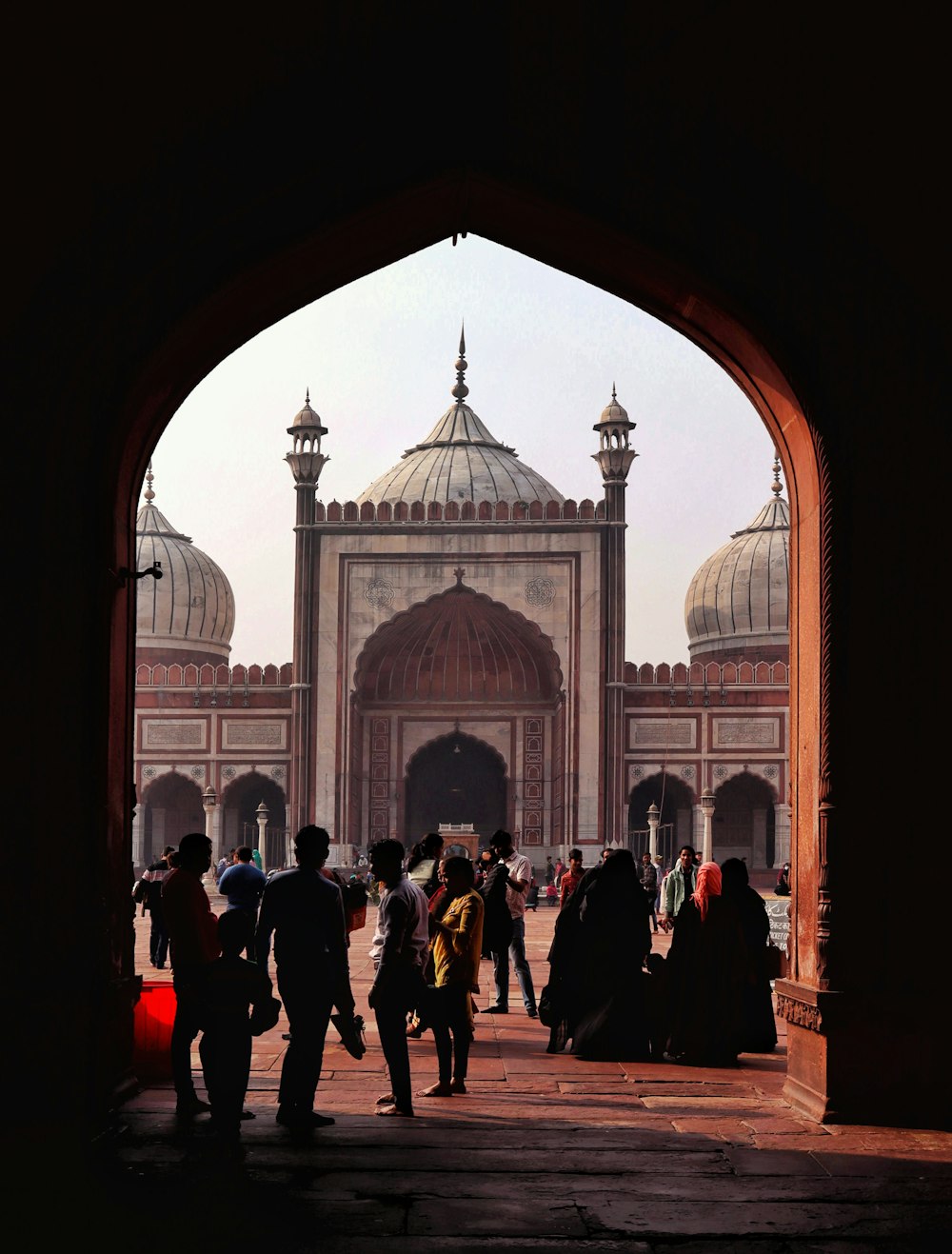 a group of people standing in front of a building